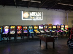 pinball games lined up at warehouse