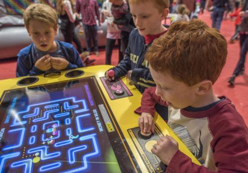 kids playing Pac Man Battle Royale